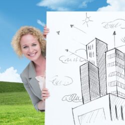businesswoman-blackboard-with-sketches-buildings_1134-507