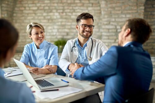 group-healthcare-workers-greeting-financial-advisor group-healthcare-workers-greeting-financial-advisor