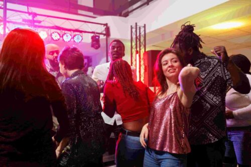 compressed_compressed_multiracial-couple-dancing-together-while-partying-crowded-nightclub-man-woman-clubbing-having-fun-dancefloor-illuminated-with-spotlights-club-discotheque compressed_compressed_multiracial-couple-dancing-together-while-partying-crowded-nightclub-man-woman-clubbing-having-fun-dancefloor-illuminated-with-spotlights-club-discotheque