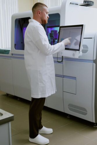 scientist-wearing-lab-coat-examining-data-touchscreen-device-medical-laboratory-setting-with_249974-27167 scientist-wearing-lab-coat-examining-data-touchscreen-device-medical-laboratory-setting-with_249974-27167