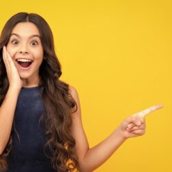 wow-it-s-unbelievable-shocked-teenager-child-pointing-aside-copy-space-teen-girl-pointing_545934-54636