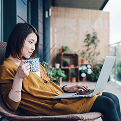 woman-city-patio-computer-240