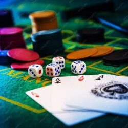 close-up-cards-with-gambling-chips-dices-table-casino_1605434-46873