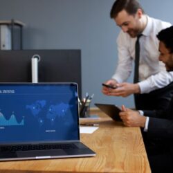 business-person-looking-finance-graphs (2) (1)