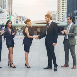 happy-business-people-shaking-hands-business-success_1150-2609