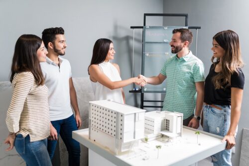 business-partners-shaking-hands-with-engineer-by-architectural-model-meeting business-partners-shaking-hands-with-engineer-by-architectural-model-meeting