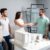 business-partners-shaking-hands-with-engineer-by-architectural-model-meeting